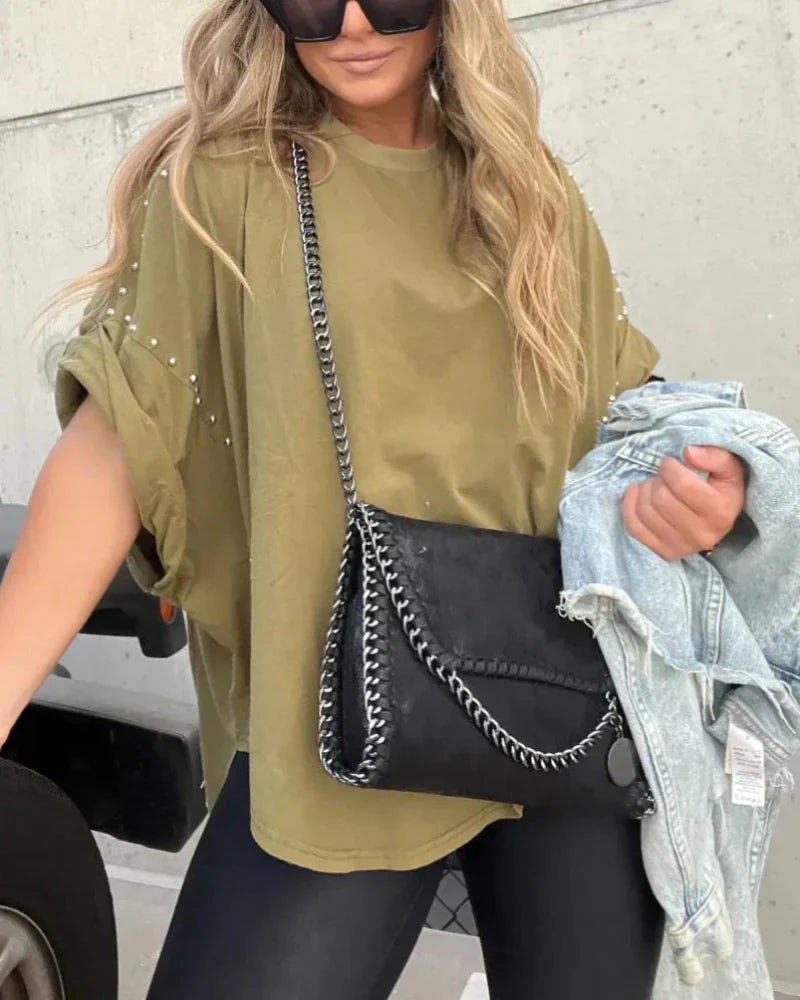 BELLA - CAMISETA OVERSIZE CON CLAVIJAS