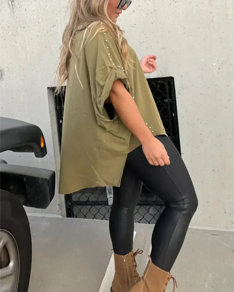 BELLA - CAMISETA OVERSIZE CON CLAVIJAS