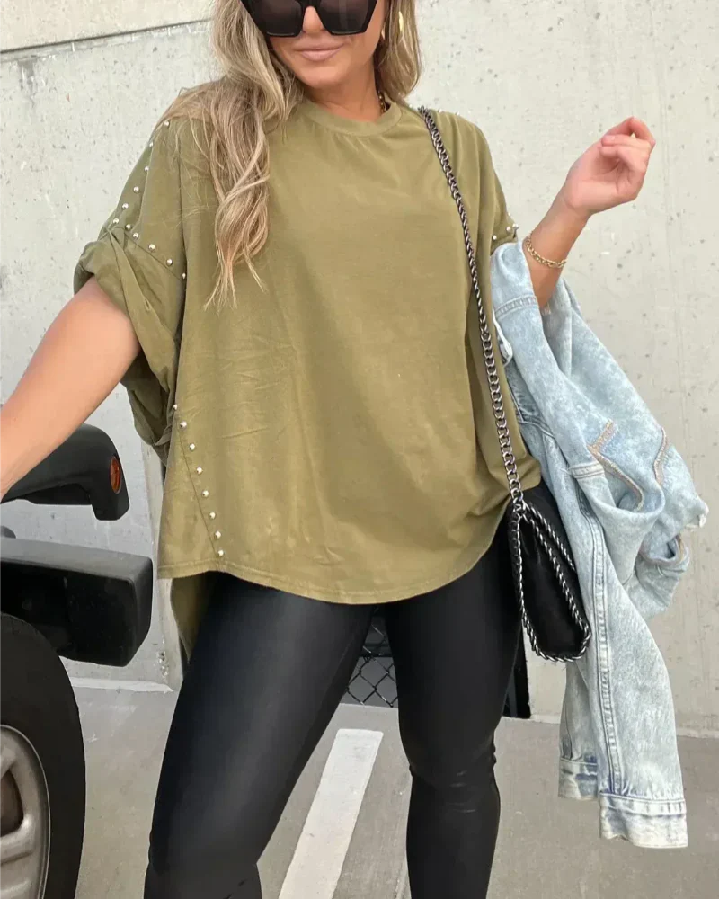 BELLA - CAMISETA OVERSIZE CON CLAVIJAS